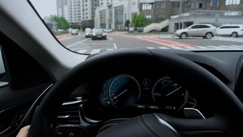 View of car dashboard while driving in city Stock Footage 89935048