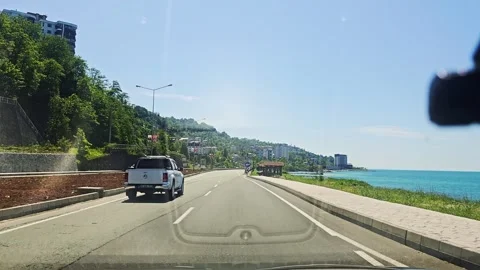 View a car driving down a road. Stock Footage 282844791