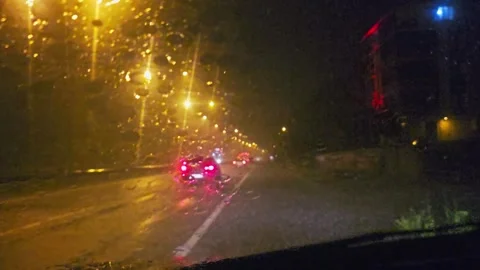 View a car driving down a street. Video stock 282684493