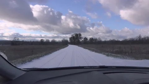 View from a car driving on a snow-covered road. Stock Footage 168646183