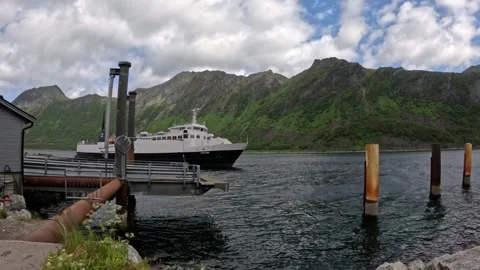 View of car ferry MF Viren approaching dock terminal in Gryllefjord Norway Vídeos de archivo 342755736