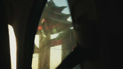 View from car on gate in buddhist temple complex with harahafu roof 库存影片 240091575