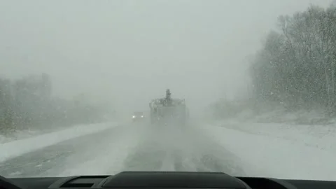 View from car to heavy snowfall on road in Russia slow motion video Stock-Footage 145742433