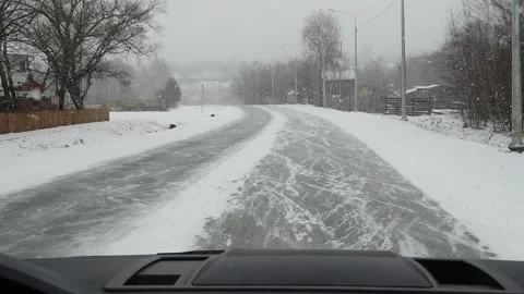 View from car to heavy snowfall on road in Russia slow motion video Stock Footage 146214196
