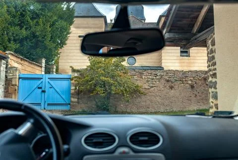 View from car inside driving on winding country road through windshield Stock Photos