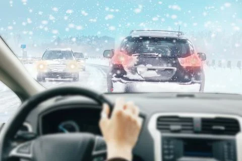 View from car inside with part of interior with driver male hand on the steer Stock Photos
