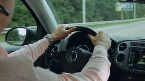 View from car interior while driving a car on highway. Hands on steering wheel Stock-Footage 336266943