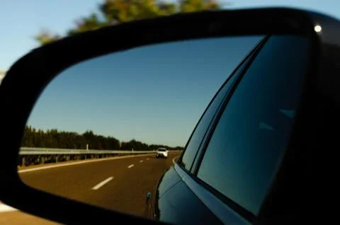 View in the car mirror on fast road in the Spain, beautiful landscape Stock-Fotos