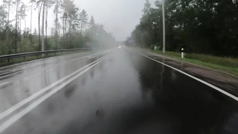 View from car moving forward on wet road during hard rain. Stock Footage 145489930