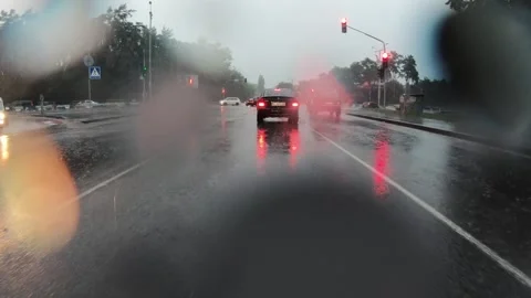View from car moving on road and stop because of red traffic light. Stock Footage 145489910