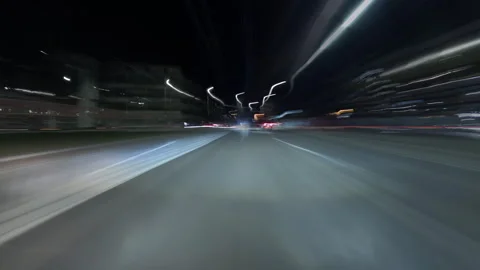 View from car of night timelapse through traffic night big city. Glittering Vidéo 267968231