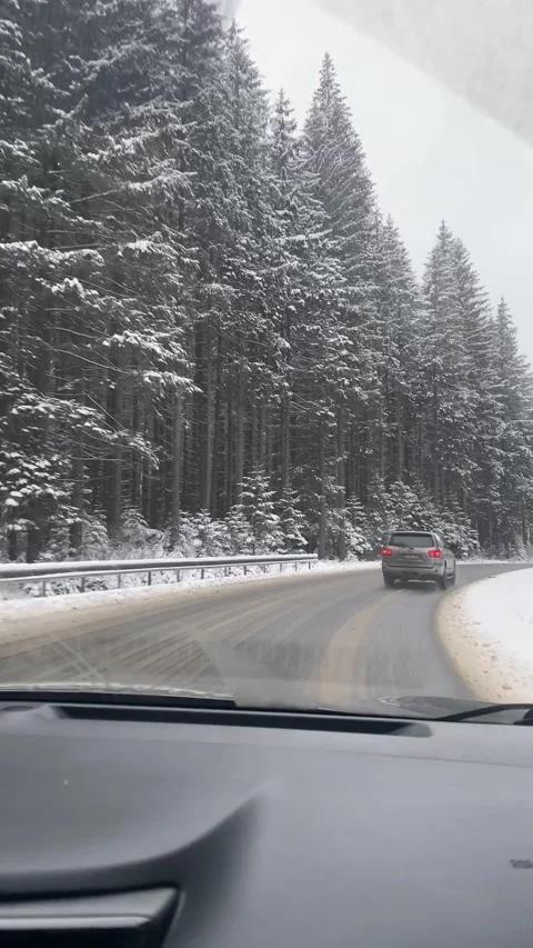 View from the car riding by winter mountain road Stock Footage 235426207