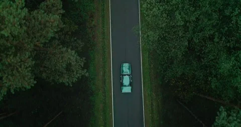 View of car on road between forests, Poland Stock Footage 147866125