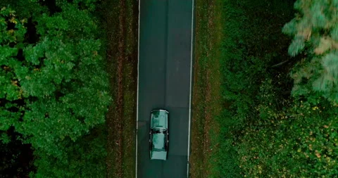 View of car on road between forests, Poland Stock Footage 147870493