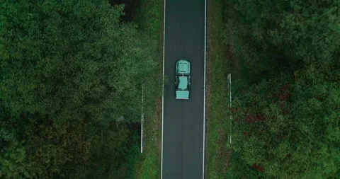 View of car on road between forests, Poland Stock Footage 147881829