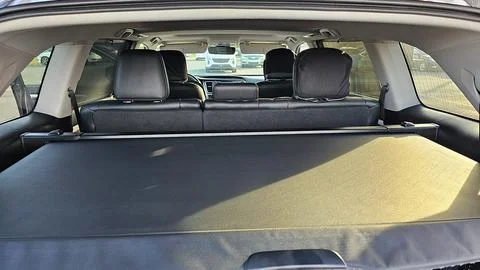A view of a car s interior, highlighting the spacious trunk area with an exte Stock Photos