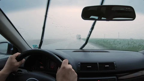 The view from the car on the steering wheel and the windshield and the highway Stock Footage 108184909