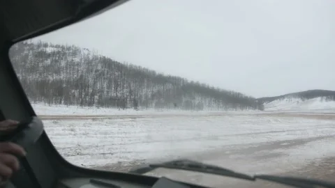 The view from the car through the windshield of the fields and hills covered 库存影片 153464299