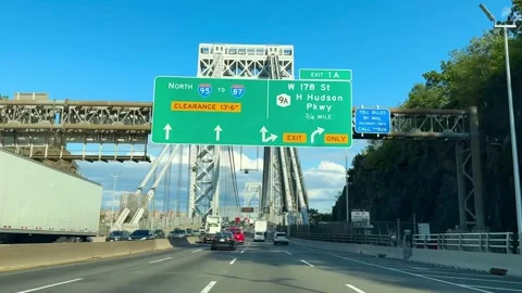 View from car while driving across George Washington Bridge toward NYC Stock Footage 316268922