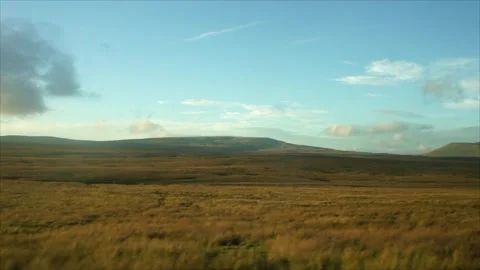 View from the Car while Driving. View of distant Mountains and Hills Stock Footage 306534601