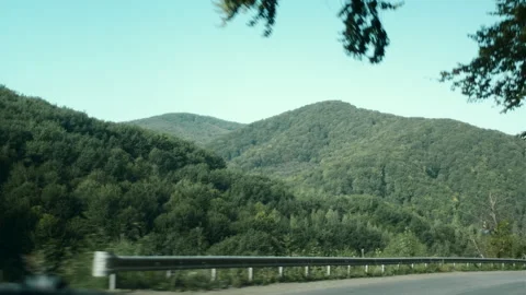 View from car window of beautiful summer or early autumn mountains at sunny day Stock Footage 284912494