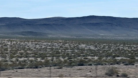 View from the car window on a beginning of a dust devil in the desert of Stock Footage 106018517