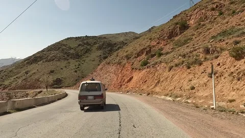View from the car window to the blue mountain lake Stock-Footage 241381697