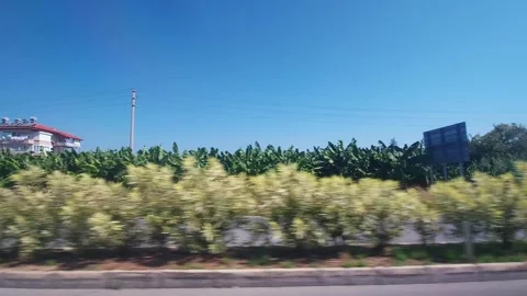 View from the car window on the buildings and houses motion. Nature of Turkey in Stock-Footage 304111191
