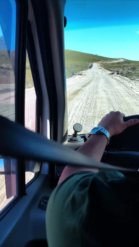 View from the car window. The car goes up hill. Mountain road. Travel by car. Video stock 294095489