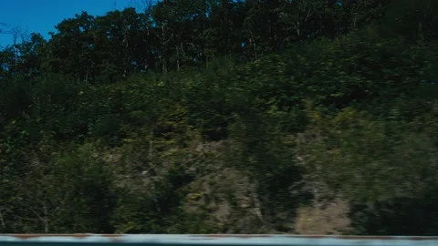 View from the car window, driving along road among the mountains. Autobahn Stock Footage 220912157