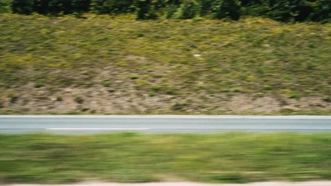 View from the car window, driving along road among the mountains. Autobahn Stock Footage 220912406