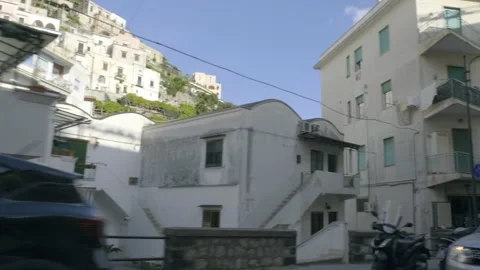 View from car window, driving through an italian village Stock Footage 169471940