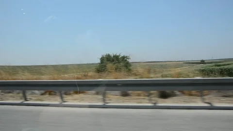 View from car window on green hills and blue sky,  Видео 112230672