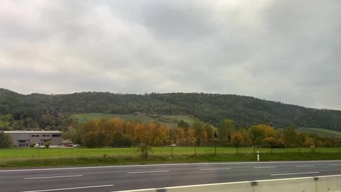 View from the car window on the highway. Car trip across Europe. Car trip along Stock Footage 316392353