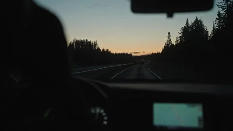 View from car window, man drinks coffee while driving on the road. Finland Video stock 270944091