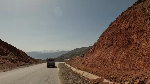 View from the car window of the mountains, green hills, ridges Stock Footage 241380970