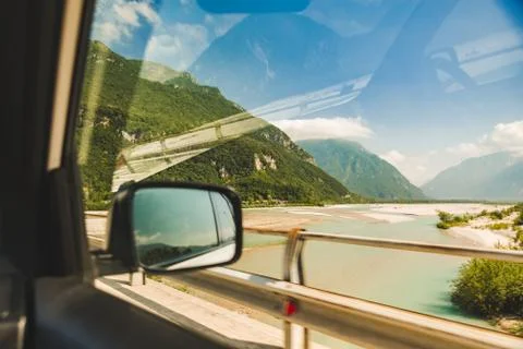 View from car window of mountains with river Stock Photos