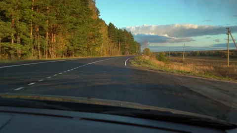 View from car window of road along autumn forest. Driving. Travel. Transport Stock Footage 219500107