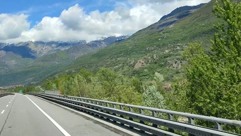 View from car window on road leading among mountains Stock Footage 289447243