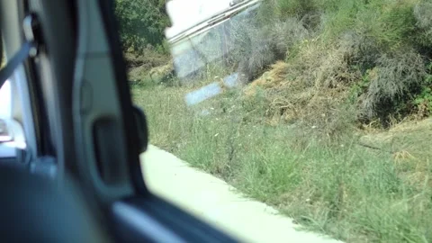 View from car window shows road sign 90 passing by Passenger seat offers a clear Vidéo 280305640