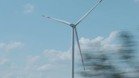 View from car window while driving to wind turbines 스톡 동영상 160120763