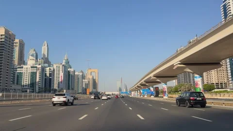 View from the car window while driving along Sheikh Zayed Road in Dubai Marina Stock Footage 311201162