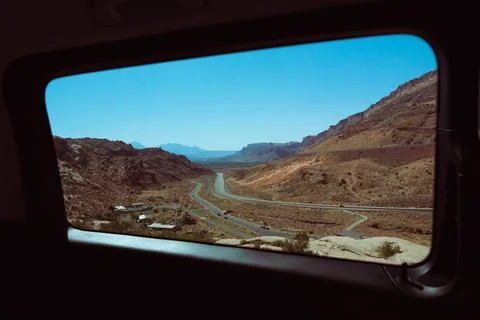 View from a car window while traveling through the mountains of Utah, USA Stock Photos