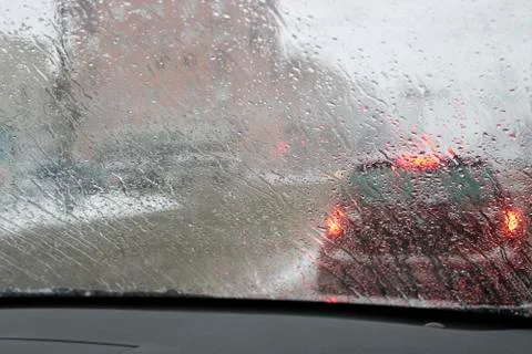View from the car windscreen during rain and wet snow. Stock Photos
