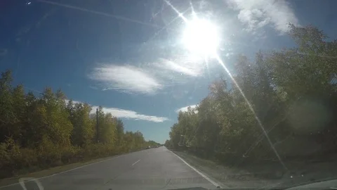 View from Car windshield. Road Trip on Suburban Road Stock Footage 70076191