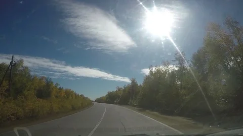 View from Car windshield. Road Trip on Suburban Road Stock Footage 70078862