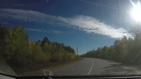 View from Car windshield. Road Trip on Suburban Road Stock Footage 70083080