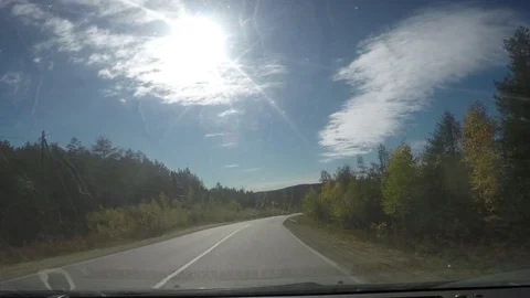 View from Car windshield. Road Trip on Suburban Road Stock Footage 70084044