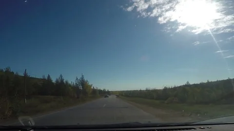 View from Car windshield. Road Trip on Suburban Road Stock Footage 70136983