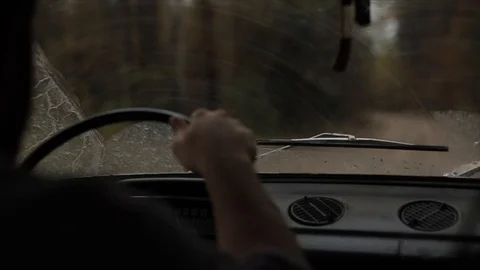 The view from the car on the windshield with the working wipers Stockbeeldmateriaal 126963941